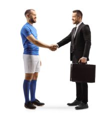 Football player and a businessman shaking hands isolated on white background